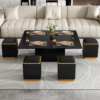 A straight-on, symmetrical view of the black coffee table converted into a full square dining table set for four people, flanked by four matching black square stools with orange bases in front of a cream couch.